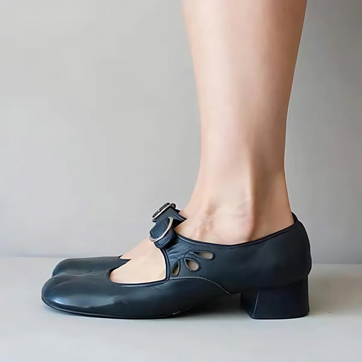 Navy leather Mary-jane sandals with buckle strap and low block heel, side view