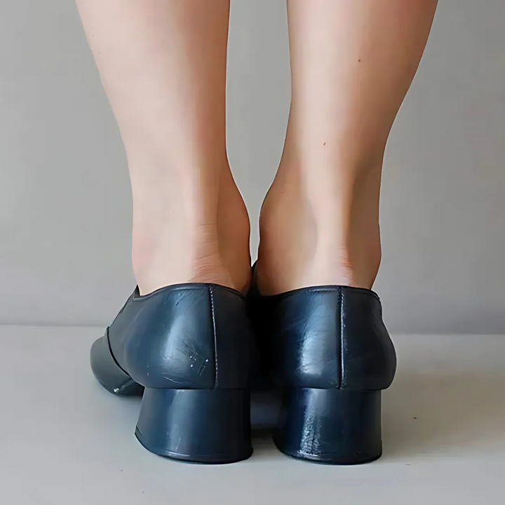 Back view of navy leather sandals with low block heels and stitched panels