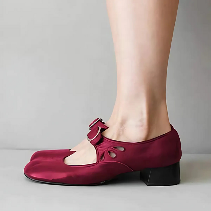 Red leather Mary-jane sandals with buckle strap and low block heel, side view