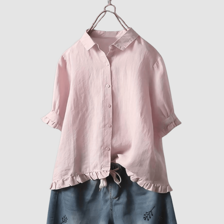 Pink breathable button-front blouse with short sleeves and ruffled hem