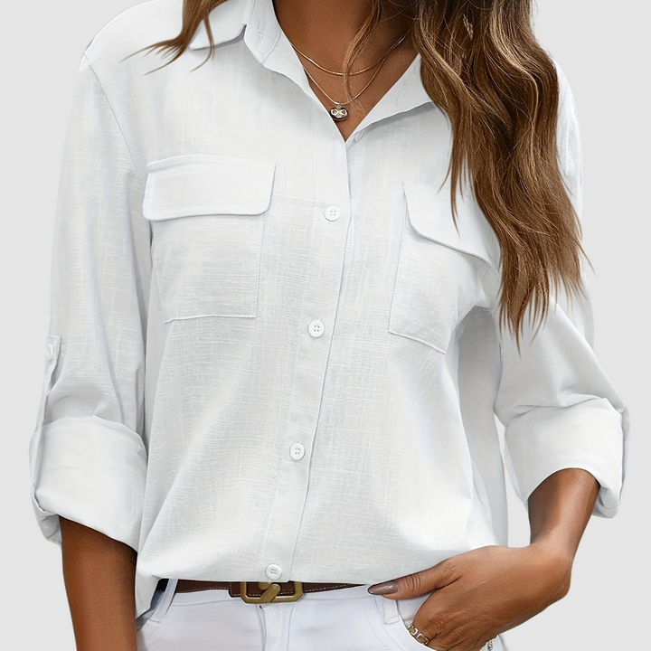 Women's white button-up blouse with chest flap pockets and long sleeves