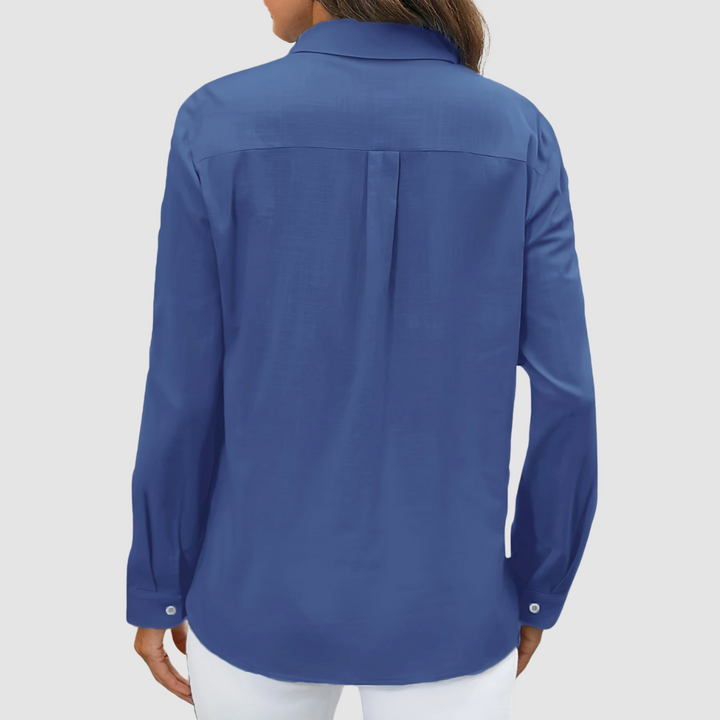 Blue button-up blouse with chest pocket, back yoke seam, and point collar