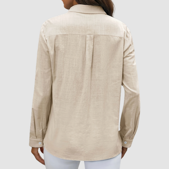 Apricot pocket blouse, back view with yoke seam and full sleeves