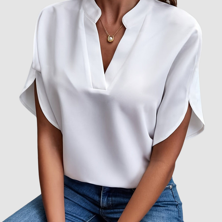 White draped blouse with V-neck and loose dolman short sleeves
