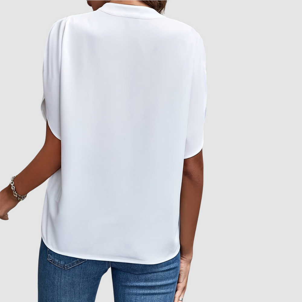 White draped blouse back view with short flutter sleeves and relaxed fit