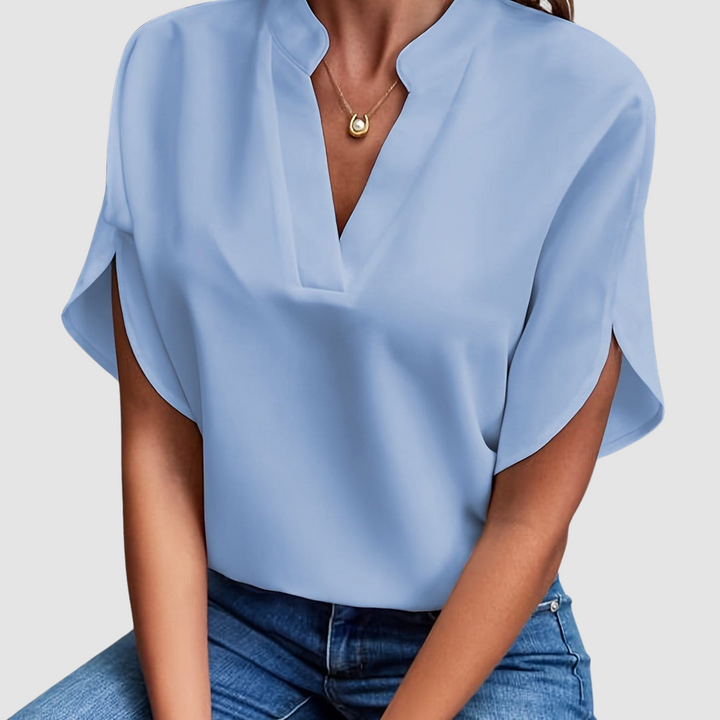 Blue draped blouse with V-neck and flowing dolman short sleeves