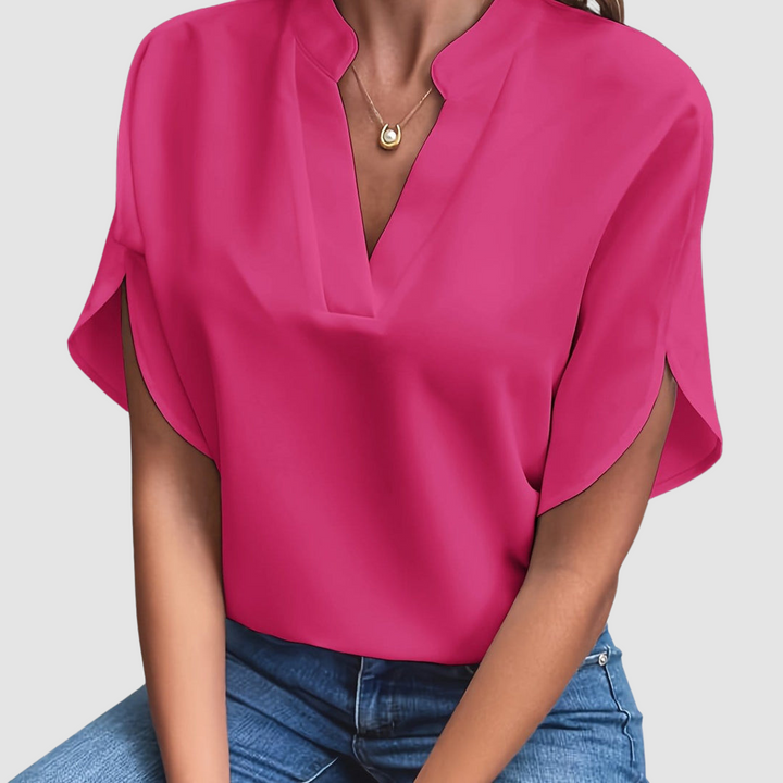 Pink draped blouse with V-neck and flowing dolman short sleeves