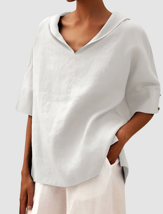 White short-sleeve blouse with V-neck and pointed collar, relaxed fit
