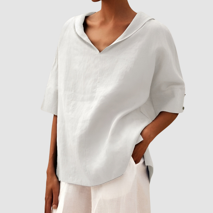 White short-sleeve blouse with V-neck and pointed collar, relaxed fit