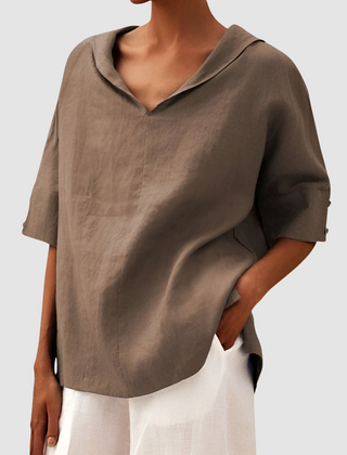 Khaki/beige short-sleeve blouse with V-neck and loose, airy fit.