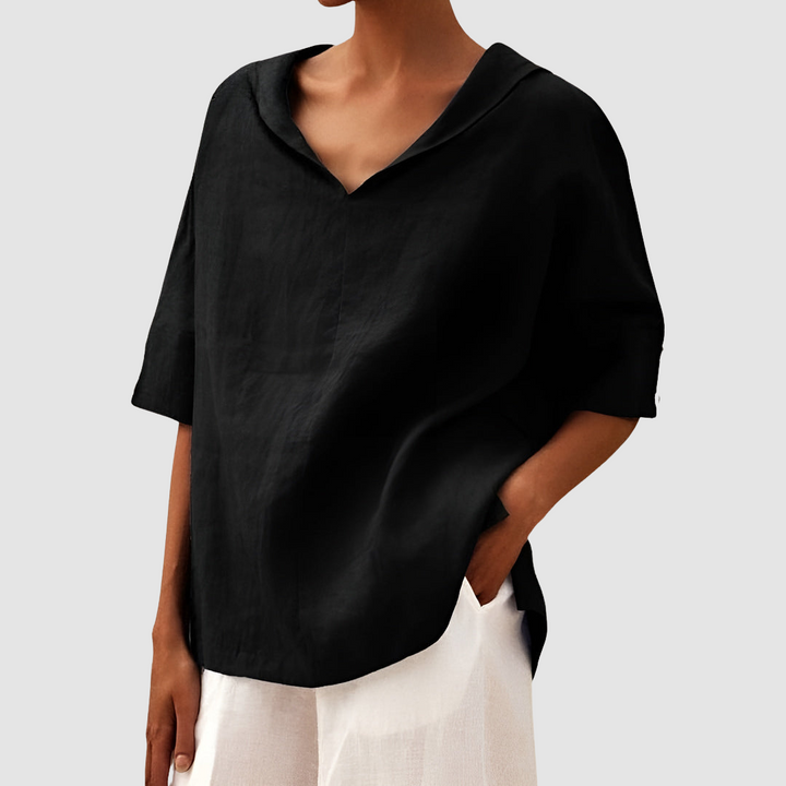 Black short-sleeve blouse with V-neck and pointed collar, relaxed drape