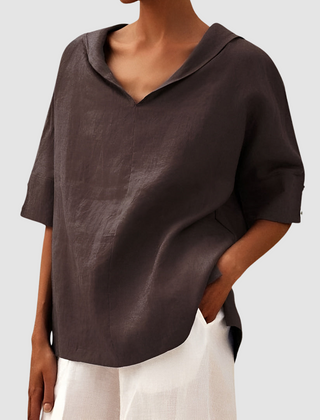 Brown short-sleeve blouse with V-neck and pointed collar, loose drape