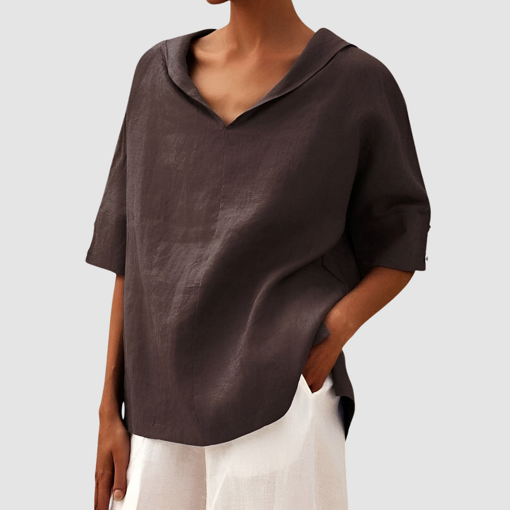 Brown short-sleeve blouse with V-neck and relaxed drape design.