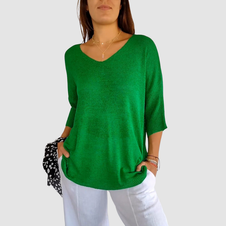 Green knit v-neck top with 3/4 sleeves and relaxed drape