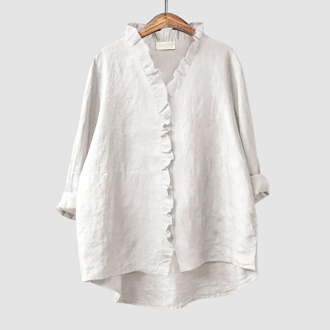 White ruffle-front blouse with three-quarter sleeves