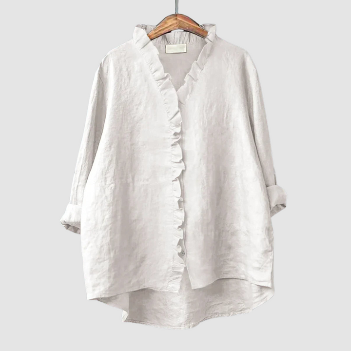 White ruffle-front blouse with three-quarter sleeves