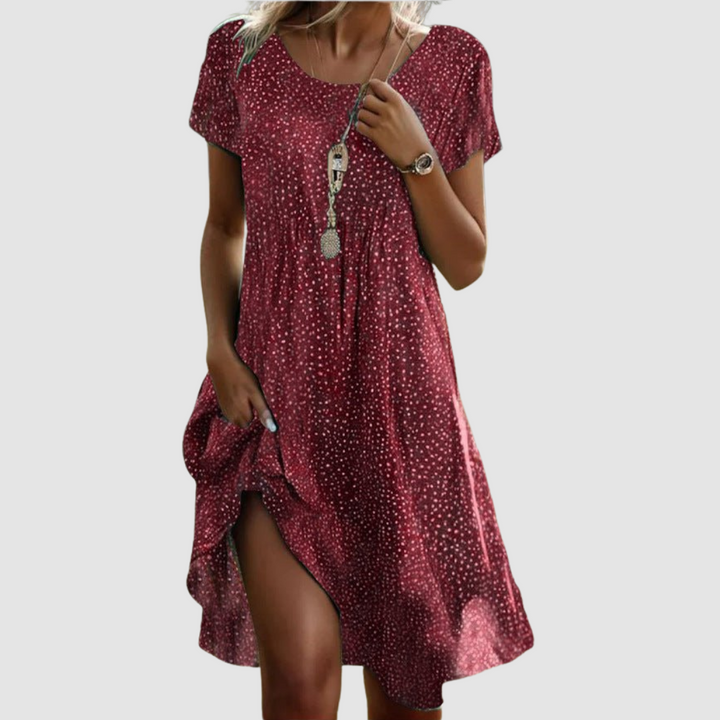 Red short-sleeve summer dress with tiny dot print, V-neck, and side slit