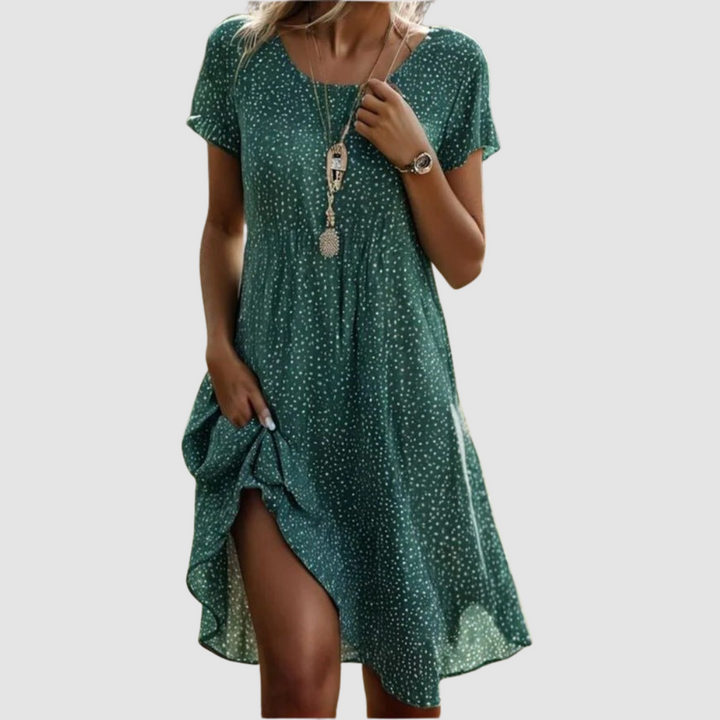 Green short-sleeve summer dress with tiny dot print, V-neck, and side slit