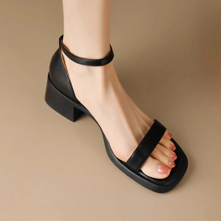 Black leather slide sandals with toe strap and chunky block heel