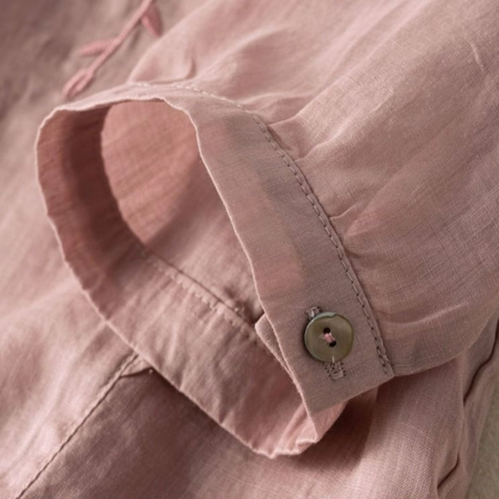 Dusty rose cotton-linen top cuff with button placket and stitched seam