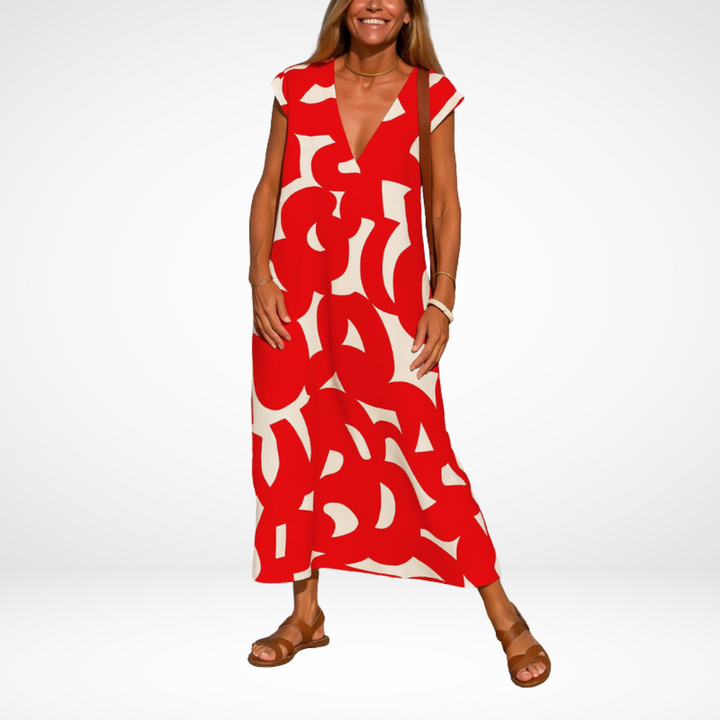 Red flowy V-neck midi dress with abstract white shapes, short cap sleeves.