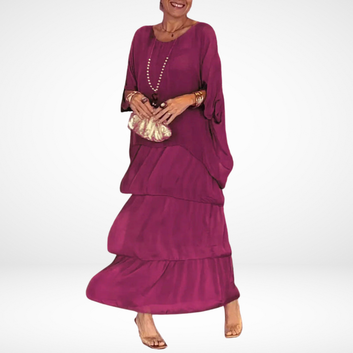 Pink loose maxi dress with tiered skirt, drapey dolman sleeves, scoop neckline.