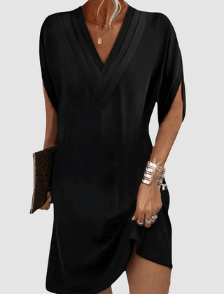 Black V-neck half-sleeve dress with draped wrap-look neckline and short curved hem