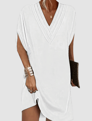 White V-neck half-sleeve dress with draped wrap-look neckline and short curved hem