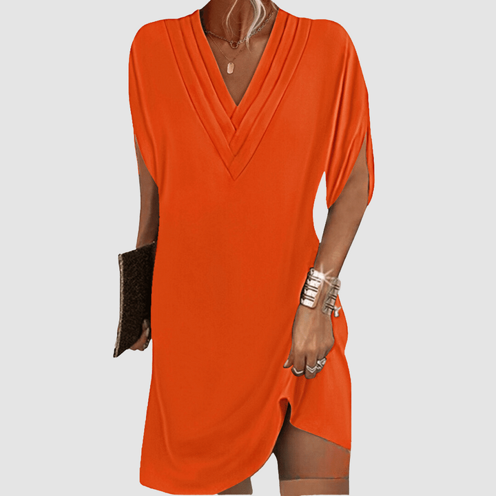Orange V-neck half-sleeve dress with draped wrap-look neckline and short curved hem