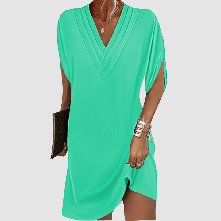 Green V-neck half-sleeve dress with draped wrap-look neckline and short curved hem