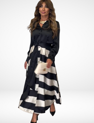 Black satin maxi dress with long sleeves, button front, striped skirt and waist belt
