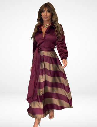Burgundy satin maxi dress with long sleeves, button front, striped A-line skirt, belt