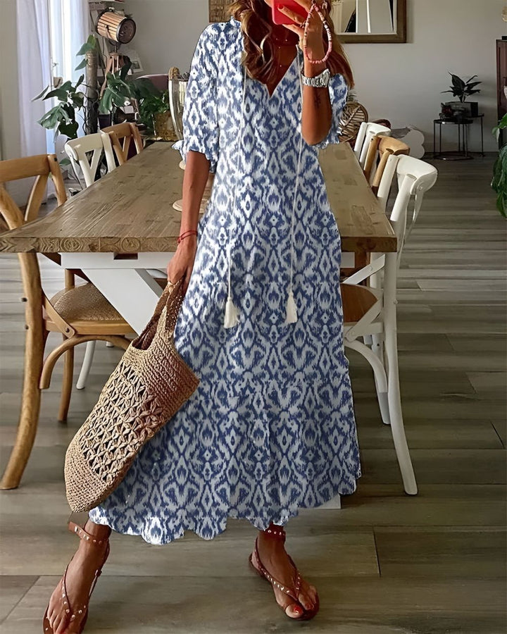 Boho covering dress in blue with diamond pattern and short sleeves.