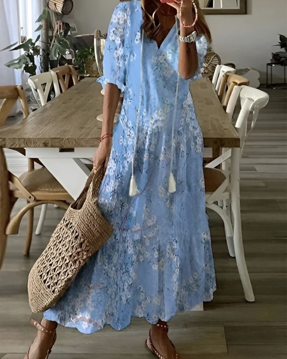 Boho covering dress in light blue with tie-dye style pattern and short sleeves.