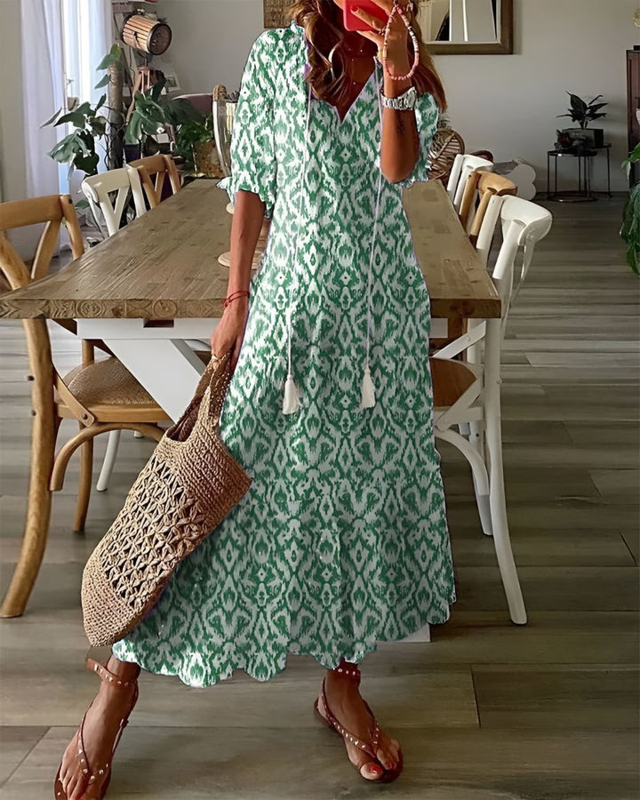 Boho covering dress in green with diamond pattern and short sleeves.