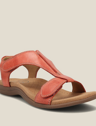 Orange orthopedic leather sandals with adjustable ankle strap and cushioned footbed