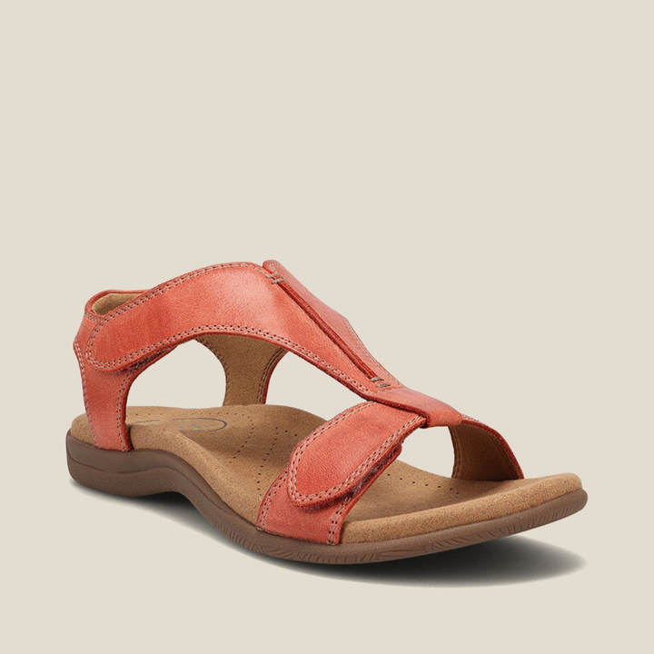 Orange orthopedic leather sandals with adjustable ankle strap and cushioned footbed