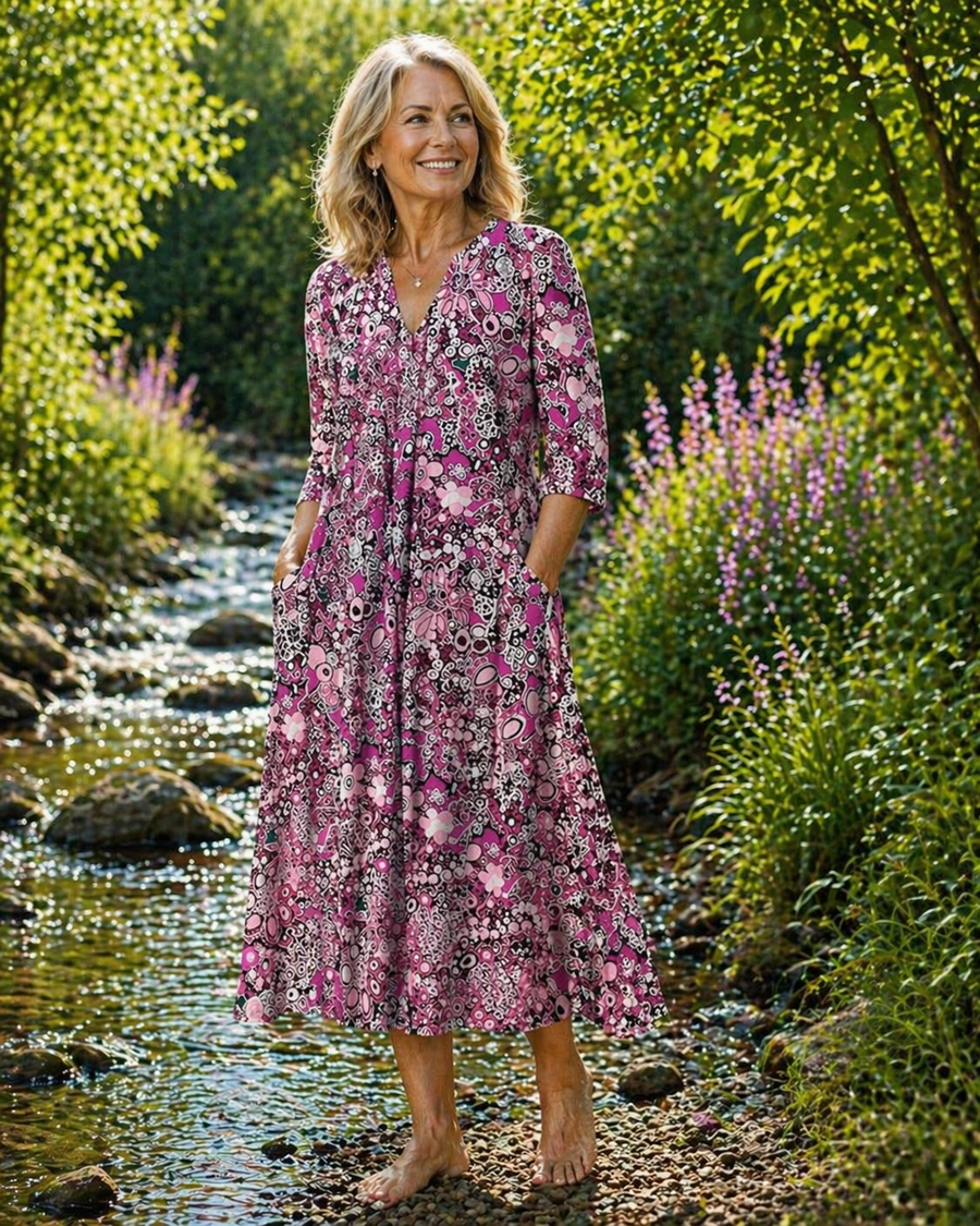 Pink patterned midi summer dress with V-neck and three-quarter sleeves