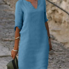 Sky blue V-neck dress with elbow-length sleeves and a straight, knee-length fit