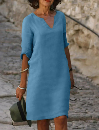 Sky blue V-neck dress with elbow-length sleeves and a straight, knee-length fit
