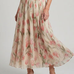 Floral midi skirt portion with pink tulip prints on light cream background, pleated