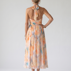 Soft halter midi dress back with open tie detail and pastel orange-blue print