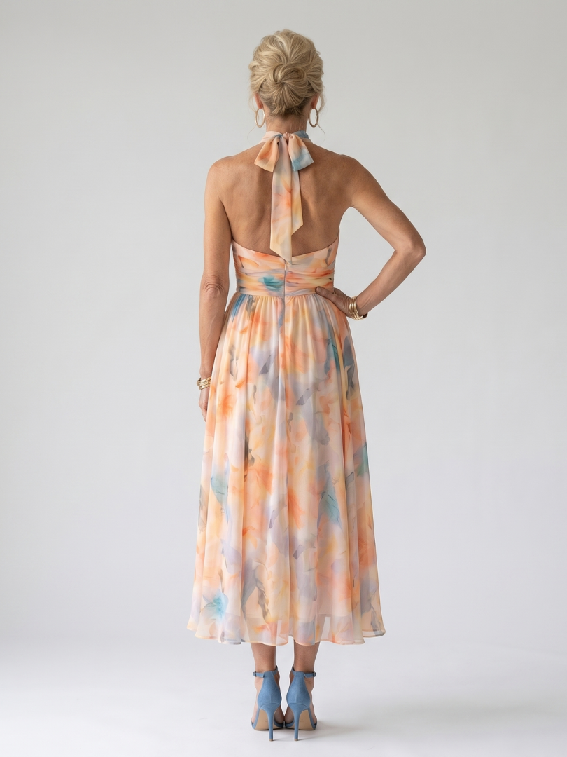 Soft halter midi dress back with open tie detail and pastel orange-blue print