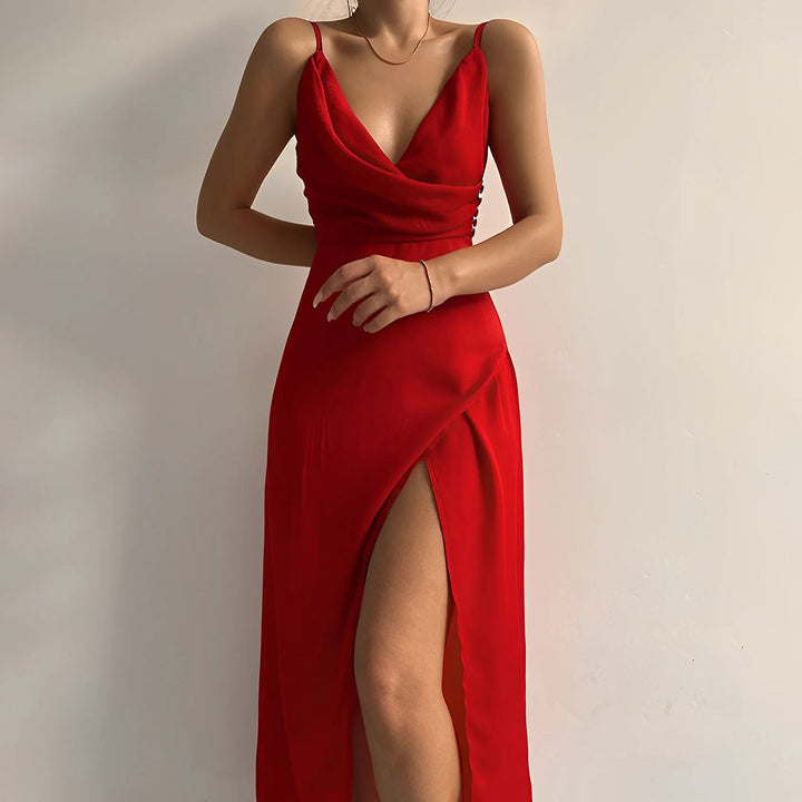 Red satin slip dress with thin straps, cowl neckline, and thigh-high slit