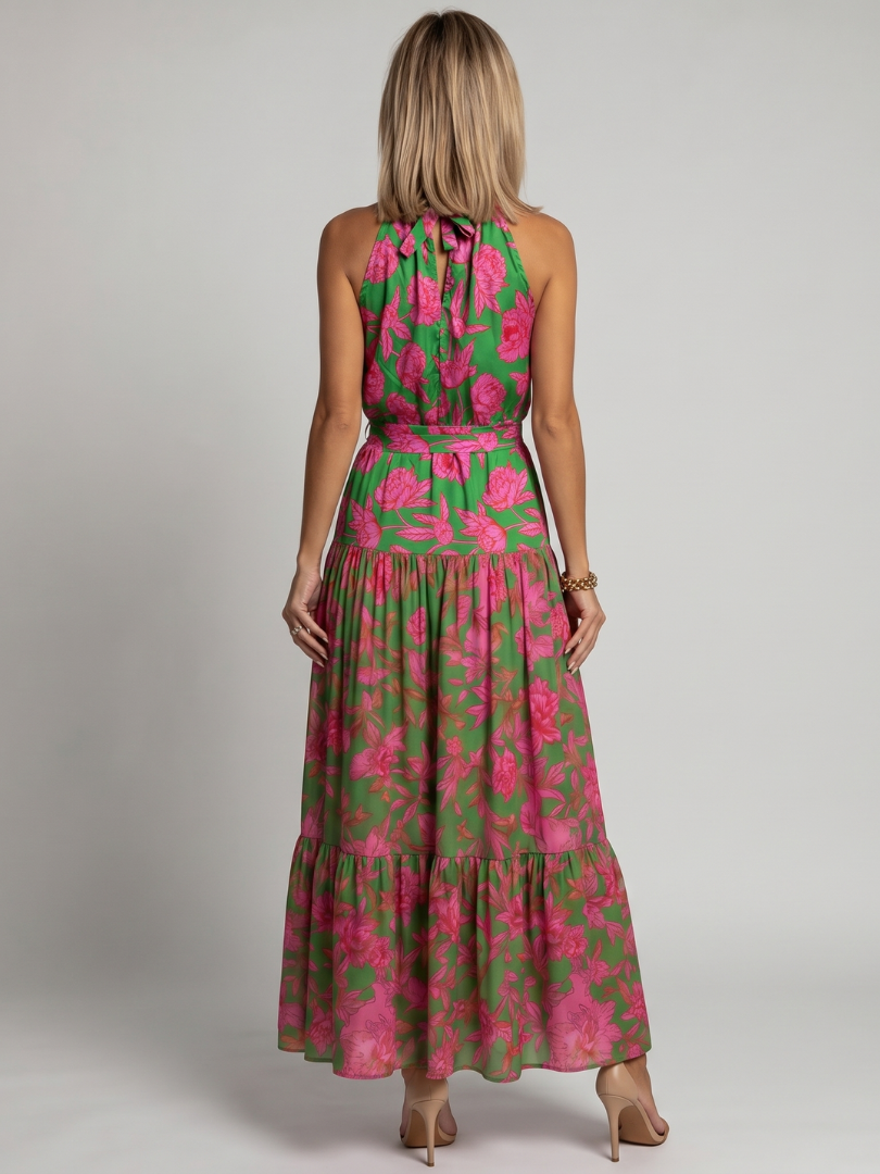 Back view floral halter midi dress in green with pink print and tiered skirt