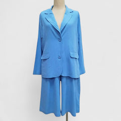 Blue 2-piece suit set with short blazer and wide-leg shorts, V-neck styling