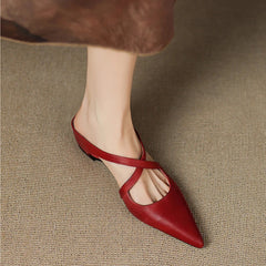 Red leather slingback mules with pointed toe, low heel, side profile.