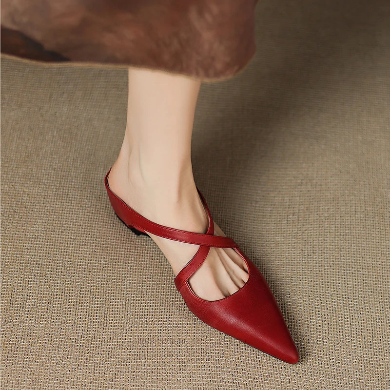 Red leather slingback mules with pointed toe, low heel, side profile.