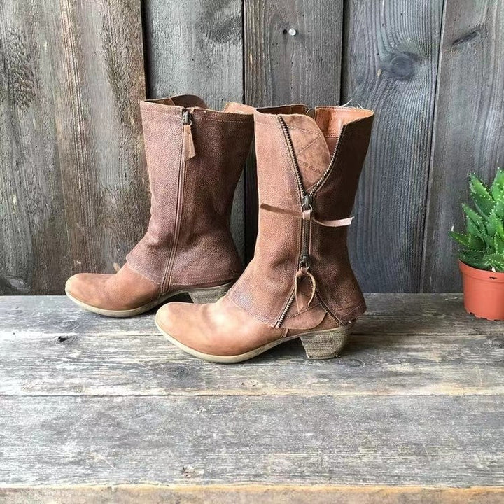 Brown mid-calf boots with side zipper, subtle stitching, low heel