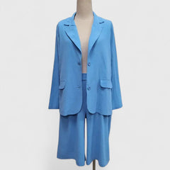 Blue 2-piece suit set with button-front blazer and matching shorts, front view